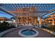 Relaxing hot tub area with pergola and access to the pool area at 470 Mandalay Ave # 306, Clearwater Beach, FL 33767