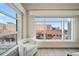 Bright living room with large windows and city views at 470 Mandalay Ave # 306, Clearwater Beach, FL 33767