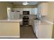 Kitchen with white cabinets and stainless steel appliances at 504 Holly Ln, Brandon, FL 33510