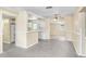 Bright living room with seamless flow to a white-cabinet kitchen at 504 Holly Ln, Brandon, FL 33510