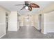 Open-concept living area with ceiling fan and a view of the adjacent kitchen at 504 Holly Ln, Brandon, FL 33510