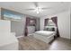 Bedroom with a full-size bed, gray walls, and ceiling fan at 5243 27Th N Ave, St Petersburg, FL 33710