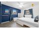 Bedroom with a full-size bed, blue walls, and a ceiling fan at 5243 27Th N Ave, St Petersburg, FL 33710