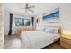 Bedroom with queen bed, light wood dresser, and ocean-themed artwork at 5243 27Th N Ave, St Petersburg, FL 33710