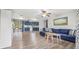 Open living room with blue couch and kitchen view at 5243 27Th N Ave, St Petersburg, FL 33710