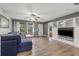 Spacious living room featuring a sectional sofa and built-in entertainment center at 5243 27Th N Ave, St Petersburg, FL 33710