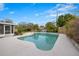 Relaxing kidney-shaped pool surrounded by lush landscaping at 5243 27Th N Ave, St Petersburg, FL 33710