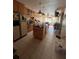 View of the home's kitchen with tile flooring and center island at 530 62Nd S Ave, St Petersburg, FL 33704