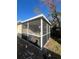 Small screened porch with seating area at 530 62Nd S Ave, St Petersburg, FL 33704