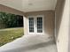 Covered back porch with access to backyard at 5352 Tangerine Dr, New Port Richey, FL 34652