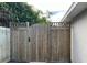 Wooden fence and gate leading to backyard at 5352 Tangerine Dr, New Port Richey, FL 34652