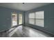 Bright bedroom with neutral walls and carpet, featuring a ceiling fan and window blinds at 5352 Tangerine Dr, New Port Richey, FL 34652