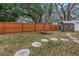 Spacious backyard with wooden fence and fire pit at 5402 8Th S Ave, Gulfport, FL 33707