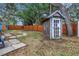 Backyard with shed, fire pit, and stone pathway at 5402 8Th S Ave, Gulfport, FL 33707