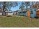 Large backyard with fire pit, shed, and wooden fence at 5402 8Th S Ave, Gulfport, FL 33707