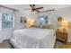 Spacious bedroom with a king-size bed and wood nightstand at 5402 8Th S Ave, Gulfport, FL 33707