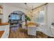 Bright dining area with a round table and four white chairs, adjacent to the kitchen at 5402 8Th S Ave, Gulfport, FL 33707