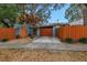 Home exterior with orange gate and double garage doors at 5402 8Th S Ave, Gulfport, FL 33707