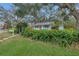 Quaint house with lush greenery, a stop sign, and a mailbox at 5402 8Th S Ave, Gulfport, FL 33707