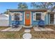 Quaint beach cottage with orange door and blue siding at 5402 8Th S Ave, Gulfport, FL 33707