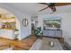 Modern kitchen with white cabinets, a copper sink, and open shelving at 5402 8Th S Ave, Gulfport, FL 33707