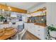 White kitchen with butcher block countertops, open shelving, and stainless steel appliances at 5402 8Th S Ave, Gulfport, FL 33707