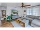 Spacious living area with light floors, large TV, and comfortable seating at 5402 8Th S Ave, Gulfport, FL 33707