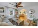 Bright living room with hardwood floors, comfy sofa, and open floor plan at 5402 8Th S Ave, Gulfport, FL 33707