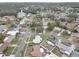 Aerial view showing home's location in a quiet residential neighborhood at 553 Lake Hill Ln, Largo, FL 33771