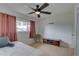 Bedroom with ceiling fan, window, and closet at 553 Lake Hill Ln, Largo, FL 33771