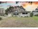 Charming ranch home with well-manicured lawn and sunset view at 553 Lake Hill Ln, Largo, FL 33771