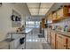 Bright kitchen with stainless steel appliances and wood cabinets at 553 Lake Hill Ln, Largo, FL 33771