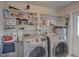 Laundry room with shelving and a washer and dryer at 553 Lake Hill Ln, Largo, FL 33771