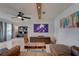 Modern living room with leather sofa and wood flooring at 553 Lake Hill Ln, Largo, FL 33771