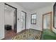 Elegant hallway with green bench and patterned rug at 605 7Th N St, St Petersburg, FL 33701