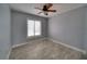 Well-lit bedroom featuring tile floors and a ceiling fan at 6530 Bimini Ct, Apollo Beach, FL 33572