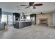 Open concept kitchen with large island and fireplace at 6530 Bimini Ct, Apollo Beach, FL 33572