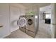 Laundry room with washer, dryer, and shelving at 6530 Bimini Ct, Apollo Beach, FL 33572