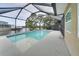 Enclosed pool and spa with canal views at 6530 Bimini Ct, Apollo Beach, FL 33572