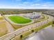 Aerial view of school campus with athletic fields and parking at 6645 Current Dr, Apollo Beach, FL 33572