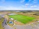 Aerial view showing a large sports field and parking area at 6645 Current Dr, Apollo Beach, FL 33572