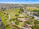 Aerial view of the community park offering walking paths, a playground, and ample green space at 6645 Current Dr, Apollo Beach, FL 33572