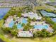 Community pool and clubhouse with tennis courts nearby at 6645 Current Dr, Apollo Beach, FL 33572