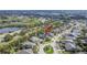 Property aerial view of the community showing the screened-in pool and mature trees at 6645 Current Dr, Apollo Beach, FL 33572