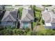 Home's aerial view shows the screened-in pool, fenced yard, and landscaping at 6645 Current Dr, Apollo Beach, FL 33572