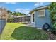 Exterior view showing the home's well-maintained lawn and screened-in pool area at 6645 Current Dr, Apollo Beach, FL 33572