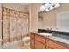 Bathroom featuring a granite countertop and a shower with a palm tree curtain at 6645 Current Dr, Apollo Beach, FL 33572