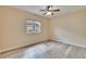 Bright bedroom with ceiling fan, luxury vinyl plank flooring and natural light at 6645 Current Dr, Apollo Beach, FL 33572