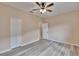 Bedroom with light walls, luxury vinyl plank flooring, and white closet doors at 6645 Current Dr, Apollo Beach, FL 33572