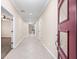 Long hallway with tiled floors leading into the house at 6645 Current Dr, Apollo Beach, FL 33572